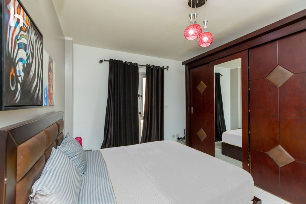 Master bedroom with ample closet space in your Central Apartment, Al Rehab City.