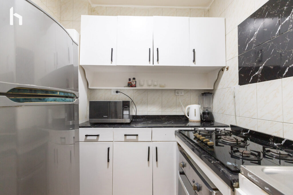 Modern bathroom with sleek finishes in your Central Apartment, Al Rehab City.