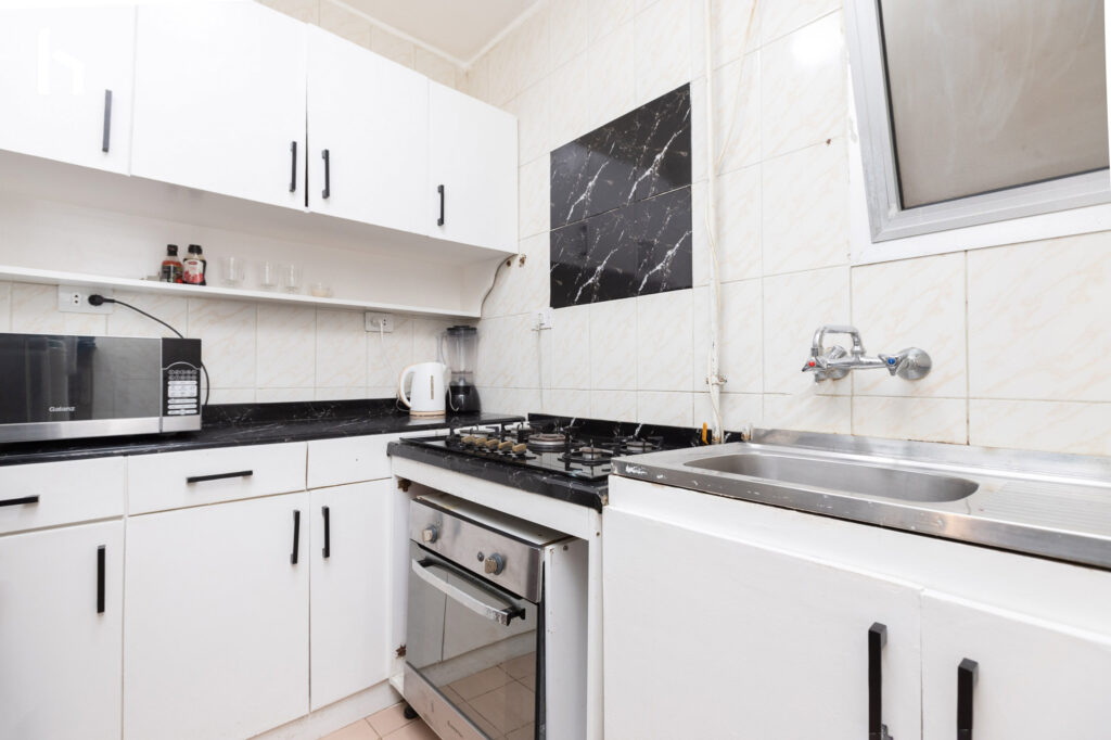 Modern bathroom with sleek finishes in your Central Apartment, Al Rehab City.