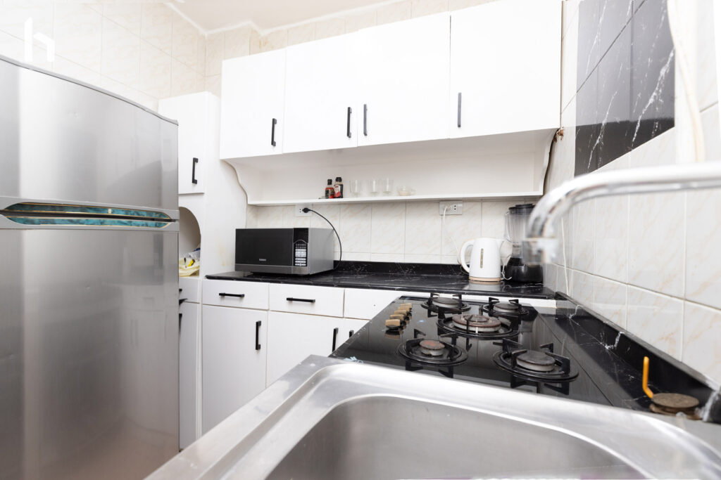 Modern bathroom with sleek finishes in your Central Apartment, Al Rehab City.