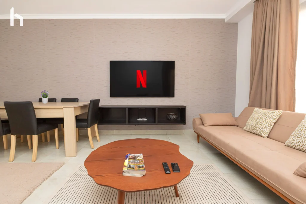 Bright and airy living room in spacious Al Rehab City apartment.