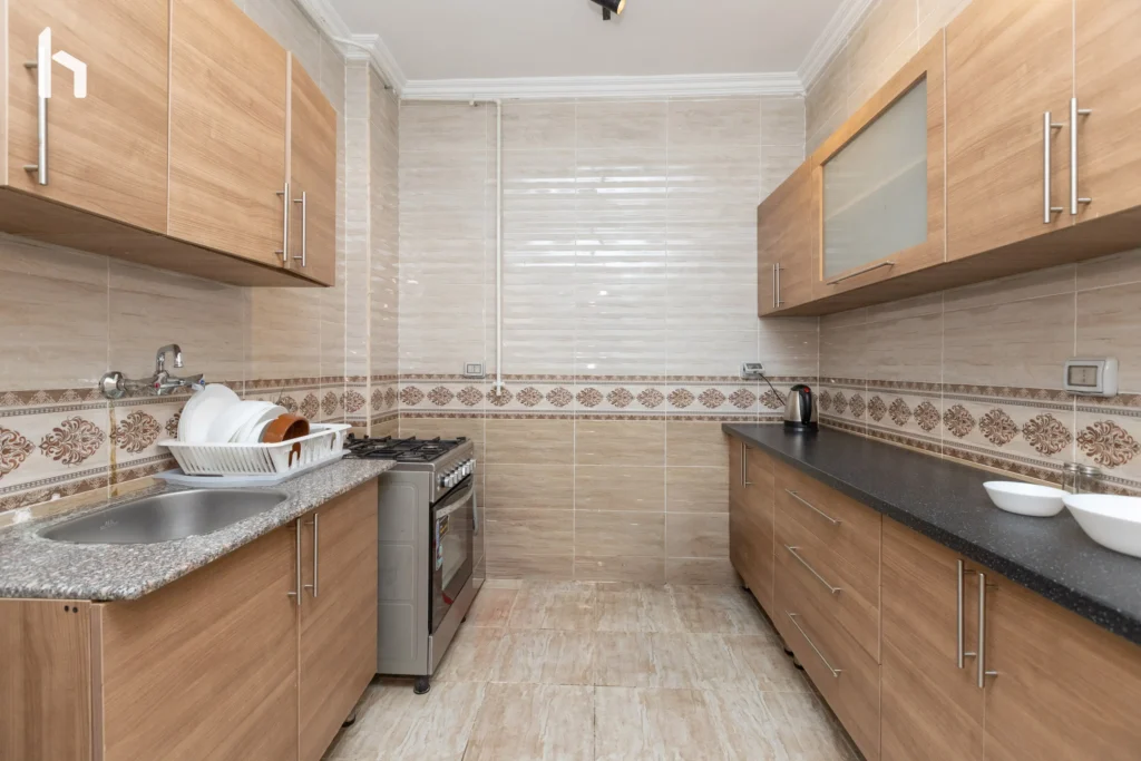 Spacious kitchen perfect for group meals in your comfortable Al Rehab City accommodation.
