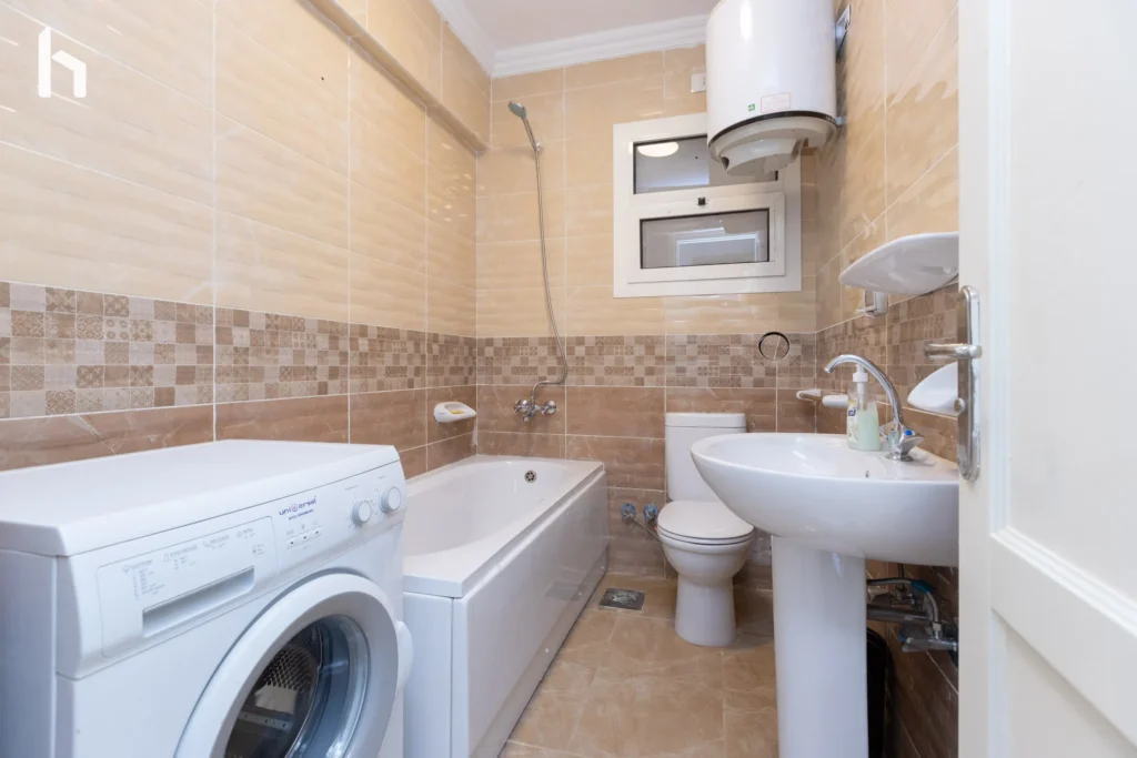 Spacious and relaxing bathroom in your Al Rehab City 3BR apartment.