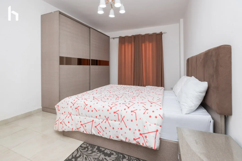 Spacious bedroom with generous closet space in your 3-bedroom apartment in Al Rehab City, Cairo, Egypt.