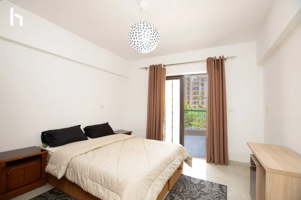Spacious bedroom with generous closet space in your 3-bedroom apartment in Al Rehab City, Cairo, Egypt.